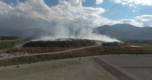 Burning Dump Site Producing Smoke