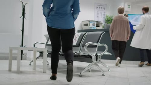 Multiethnic Group of People with Face Masks Sitting in Waiting Area