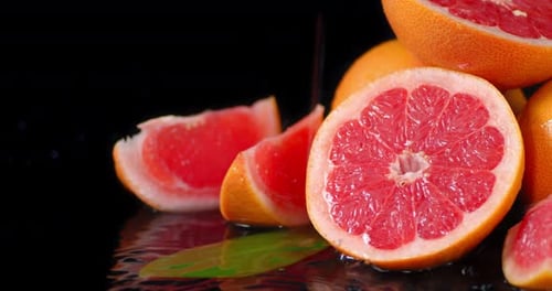 Fresh Grapefruit Slices and Halves in Close-Up