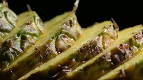 Close-Up Dolly of Juicy Sliced Pineapple