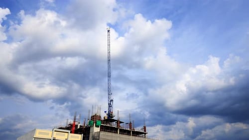 Construction Crane Lifting Building Materials in a City