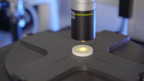 Microscope analyzing sample in lab