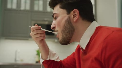 Man eating breakfast and talking