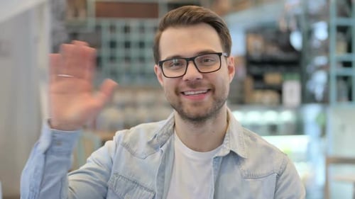 Young Man Waving Welcoming