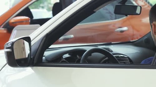 Man Smiling in Car Driver's Seat