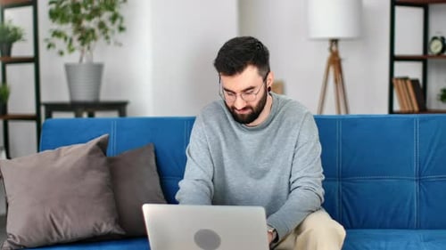 Man working on laptop at home