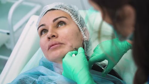 Cosmetic Procedure on Woman in Medical Setting