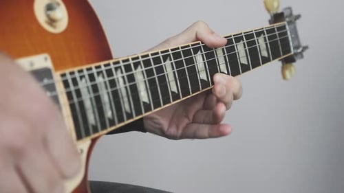 Guitarist playing solo on electric guitar. Rock solo on guitar musical instruments close up.