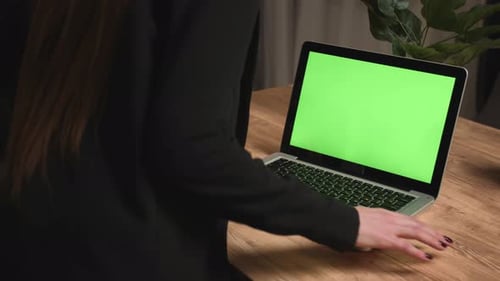 Caucasian Businesswoman Starts Working on Laptop Green Screen Chromakey at Home Office