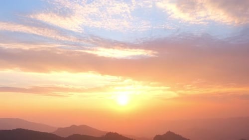 4K : Colorful of clouds above mountain during sunset.