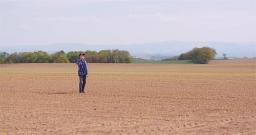 Agriculture Farmer Walking on Field.