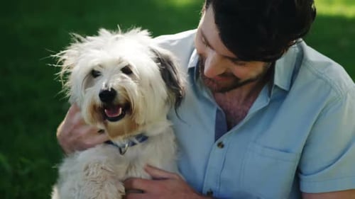 Man playing with his dog in the park
