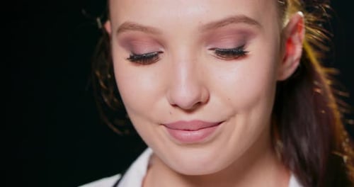 Attractive Young Woman Smiling in Close Up
