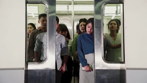 Crowd of People on a Busy Crowded Public Subway Train Travel