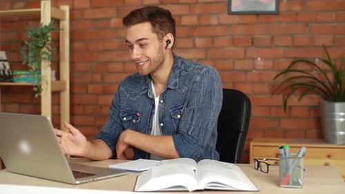 Young Man on Laptop Video Call Indoors