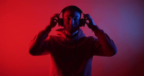 Young Man Listening To Music with Headphones