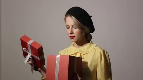 Blonde Woman Opening a Red Gift Box