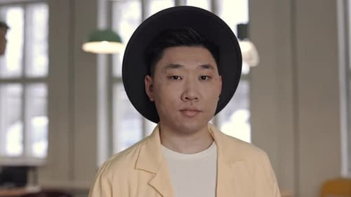 Adult Wearing Hat Looking at Camera Close Up