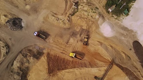 Aerial View of Excavation Site with Trucks