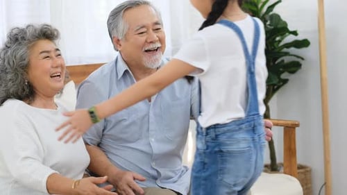 Grandparents Receive a Loving Hug From Grandchild