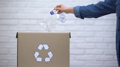 Plastic Bottles Thrown Into Recycle Box