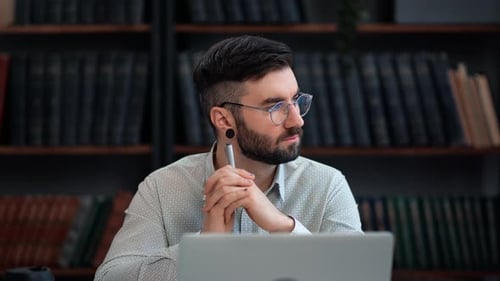 Wistful Stylish Business Man Thinking Analyzing Working Use Laptop Library Desk Workplace Interior