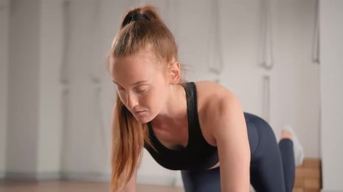 Close-up: girl doing yoga pilates stretching and looking for relaxation in meditating