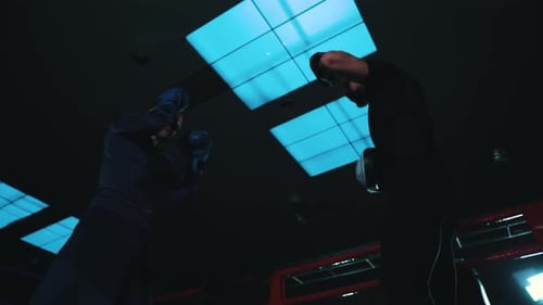 Boxer Punching Targets in a Boxing Ring