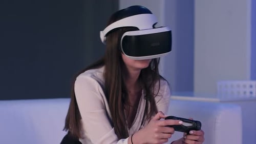 Woman Immersed in Virtual Reality Gaming at Home