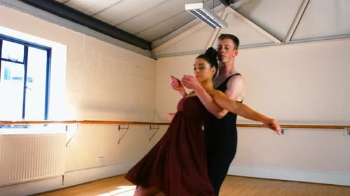 Couple Dancing in a White Studio