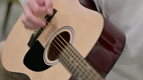 Close Up of Man Playing Guitar