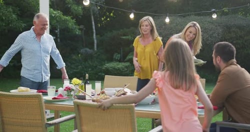 Family Gathering and Cheerful Party in Backyard