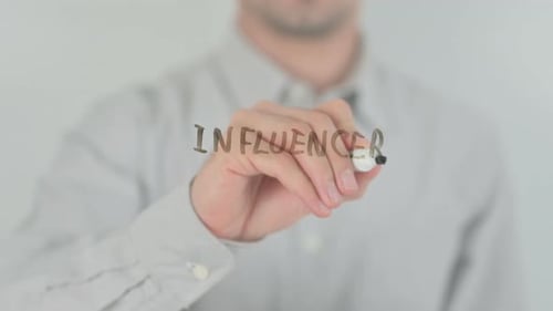 Person Writes 'Influencer' with Marker