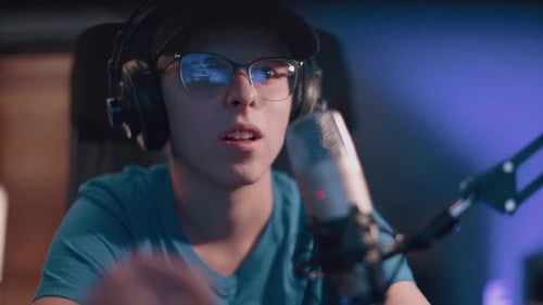 Young Adult Recording Audio with a Microphone