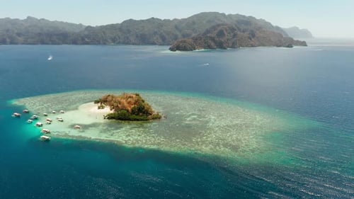 Small Tropical Island with White Sandy Beach, Top View