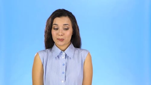 Woman Showing Expressive Facial Reactions on Blue Background