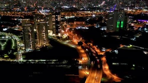 Night city landscape at downtown district. Buildings and traffic.