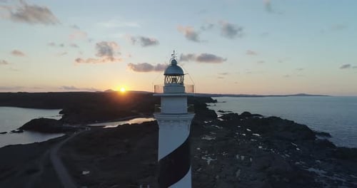 Aerial view of lighthouse at sunset 4k