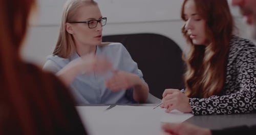 Businesswoman Discussing Strategy with Colleague