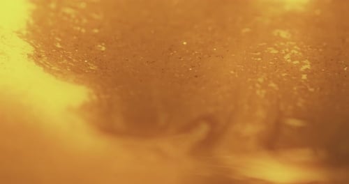 Glitter Ink Flow Golden Background Paint Spill