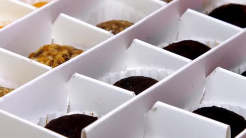 Different Coloured Natural Candies Lie in White Designed Box