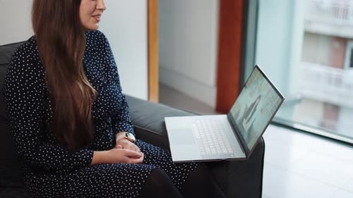 Young Woman Having Video Call in Apartment