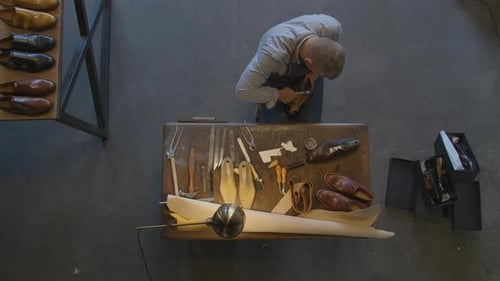 Top View Shoemaker Sews Shoes