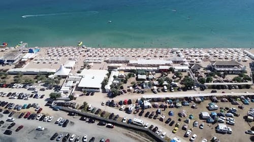 Beautiful Sandy Beach with Sun Loungers and Umbrellas for Tourists Bird'seye View