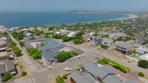 Forwards Fly Above Buildings and Streets in Residential Urban Borough