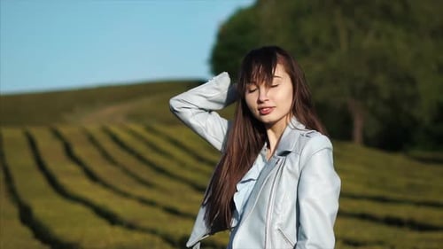 Young Woman Posing in the Green Field