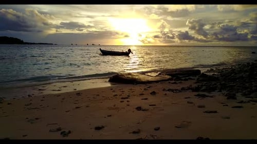 Aerial top down abstract of tranquil lagoon beach voyage by blue lagoon with white sandy background
