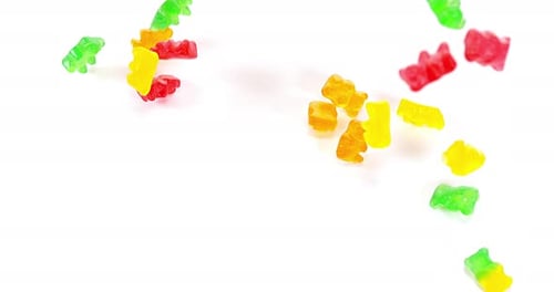 Colorful Gummy Bears Falling and Piling Up