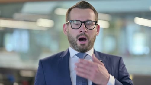 Shocked Man Covering His Mouth in Surprise