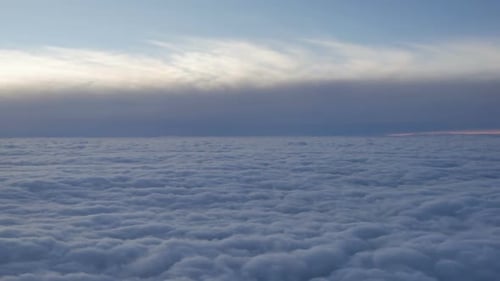 Aerial View of Fluffy Clouds at Sunrise